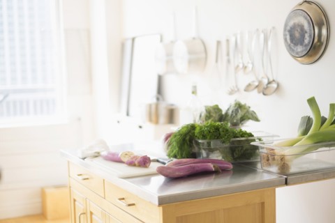 Fresh herbs on kitchen counter.