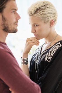 Couple arguing in living room.