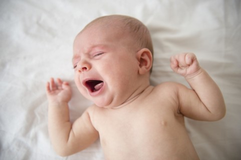 Baby girl (2-5 months) crying in crib