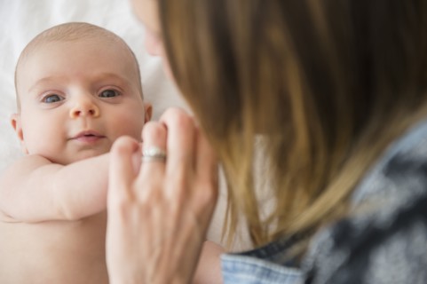 Mother consoling baby girl (2-5 months)