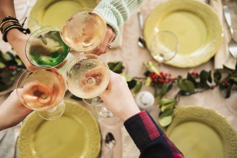 Personal perspective of people with martini glasses at festive table
