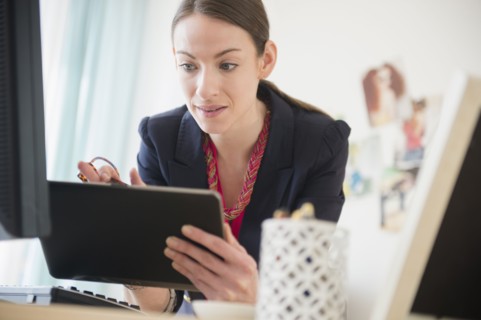 Woman using tablet in office