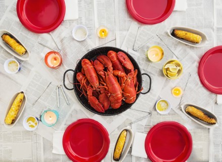 Plate with lobsters on dining table