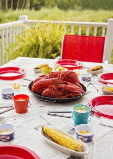 Plate with lobsters on dining table