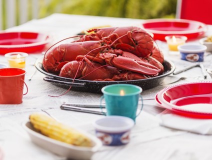 Plate with lobsters on dining table