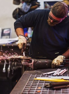 Man using circular saw in workshop