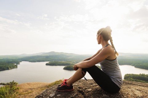 Young female hiker looking at view