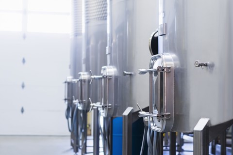 Stainless steel tanks in winery cellar
