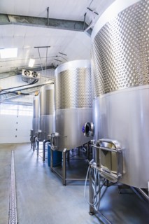 Stainless steel tanks in winery cellar