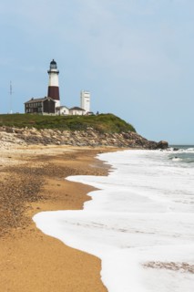 Lighthouse on cliff over sea