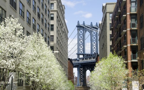 Manhattan Bridge seen between residential buildings