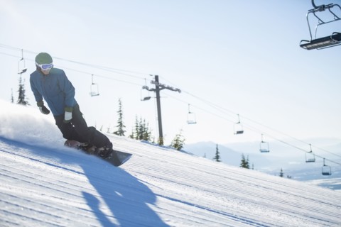 Man snowboarding downhill