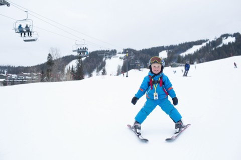 Smiley little boy (5) at ski resort