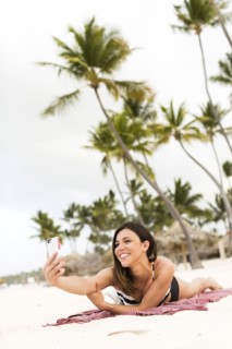 Woman in bikini relaxing on beach