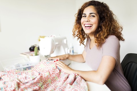 Woman using sewing machine