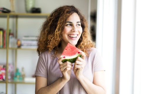 Woman holding water melon