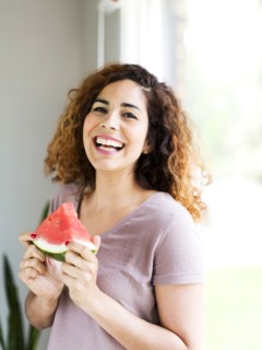 Woman holding water melon