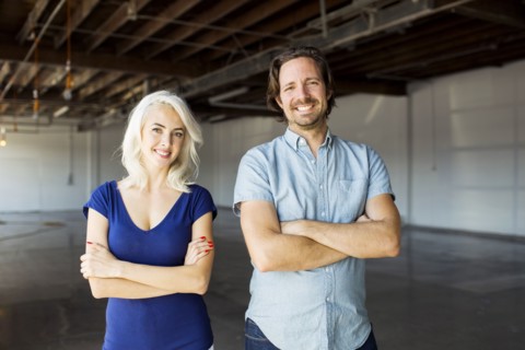 Woman and man standing in warehouse