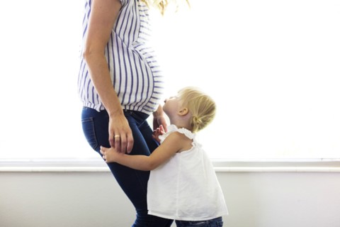 Daughter (2-3) with pregnant mother