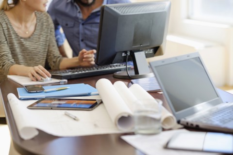Man and woman working in office.