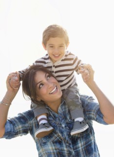 Woman playing with son (2-3).