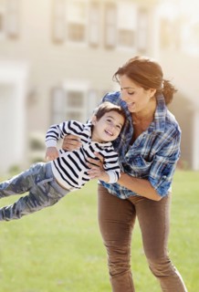 Woman playing with son (2-3).