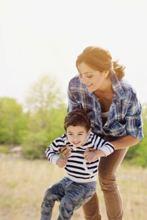 Woman playing with son (2-3).