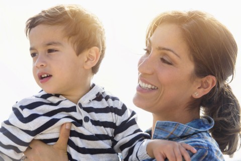 Woman playing with son (2-3).