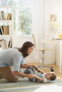 Mother playing with son (2-3).