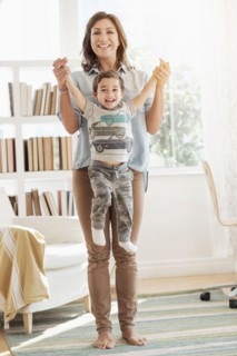 Mother holding son (2-3).