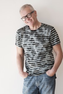 Portrait of cool man against white.
