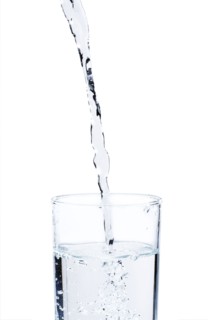 Studio shot of water pouring into glass.