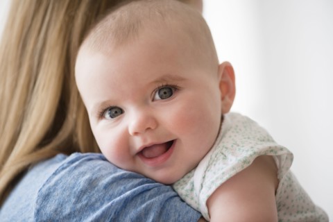 Portrait of baby girl (12-17 months) with mother