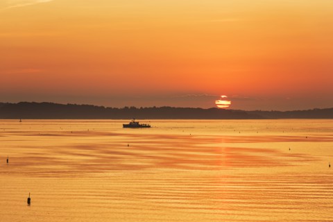 Lobstermen fishing in golden sunrise