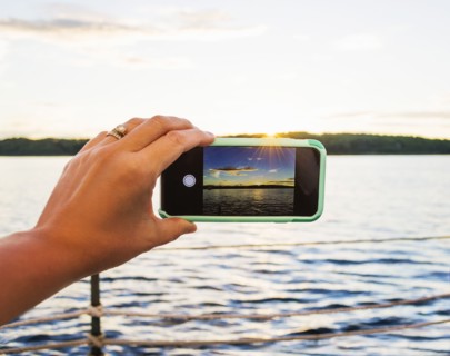 Woman taking picture with smartphone