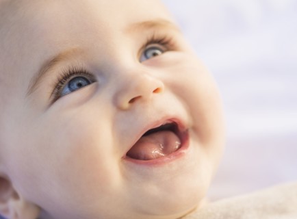 Portrait of laughing baby boy (6-11 months)
