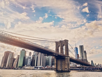 Brooklyn Bridge over Hudson River with Financial district in background