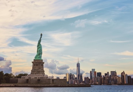 Statue of Liberty and financial district at dusk