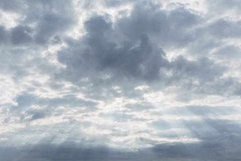 Scenic cloudscape with sunbeams