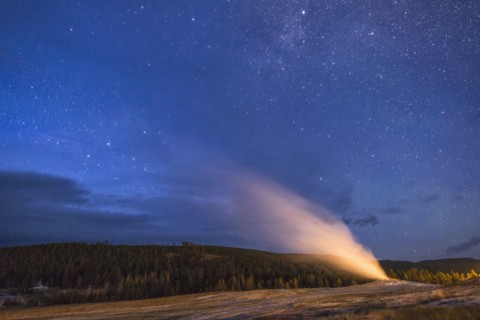Geyser erupting at night