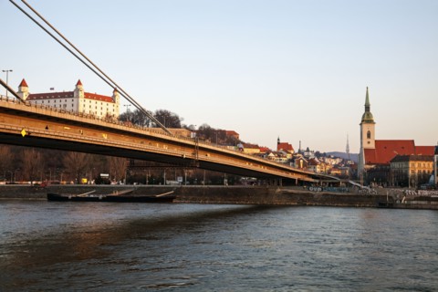 Bridge over water with city in background