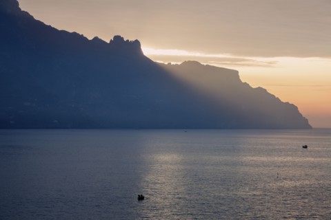 Silhouette of coastline at sunrise