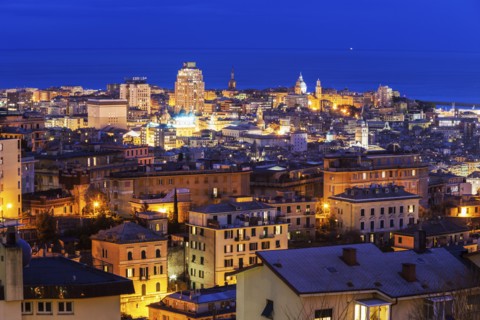 Cityscape with harbor in background at dusk