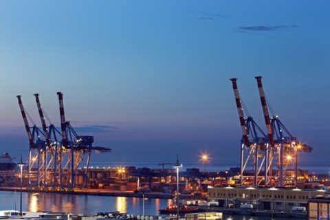 Genoa harbor cranes at sunrise