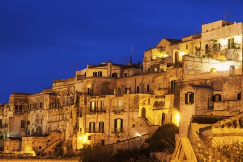 Illuminated city buildings at dusk