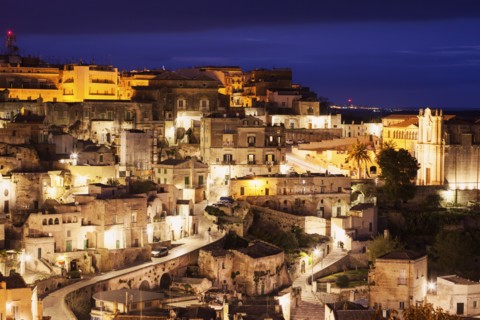 Illuminated city buildings at dusk