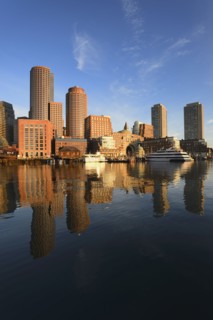 City waterfront reflected in harbor