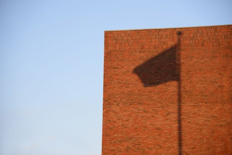 Shadow of flag on wall