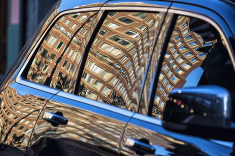 Building reflected in car