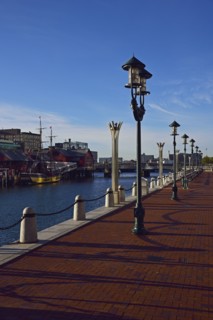 Pedestrian walkway at waterfront in sunlight